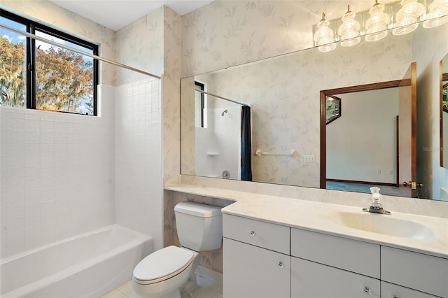 full bathroom featuring vanity, toilet, and tiled shower / bath