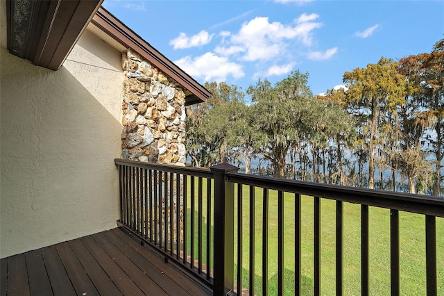 wooden terrace with a yard