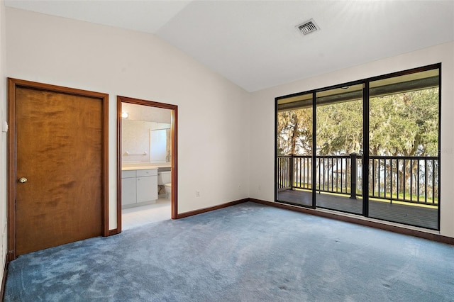 unfurnished bedroom featuring access to outside, ensuite bathroom, light colored carpet, and lofted ceiling