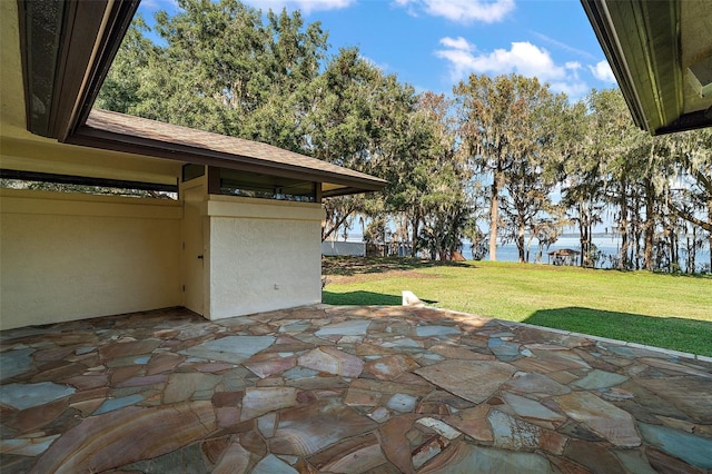 view of patio featuring a water view