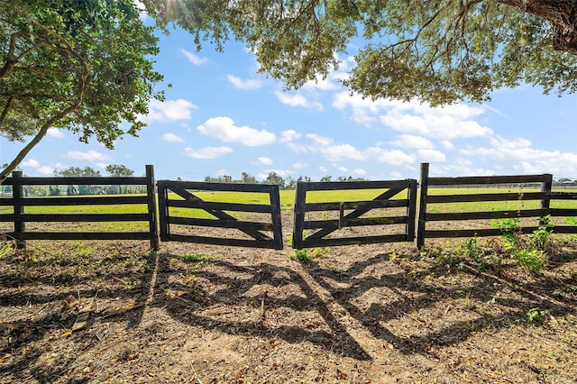 view of gate featuring a rural view