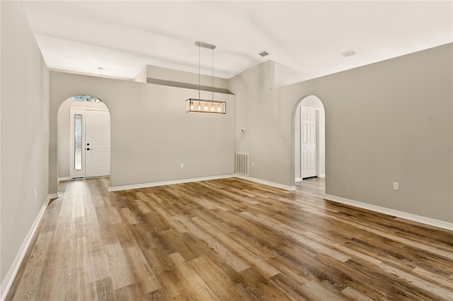 spare room with hardwood / wood-style floors