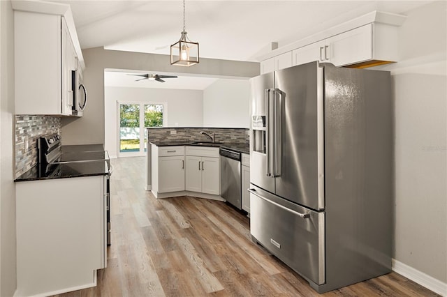 kitchen featuring sink, decorative backsplash, ceiling fan, appliances with stainless steel finishes, and white cabinetry