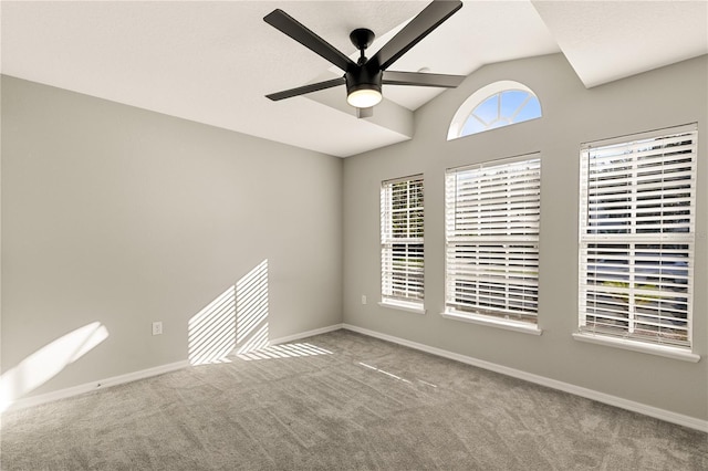 unfurnished room featuring carpet flooring, ceiling fan, and vaulted ceiling