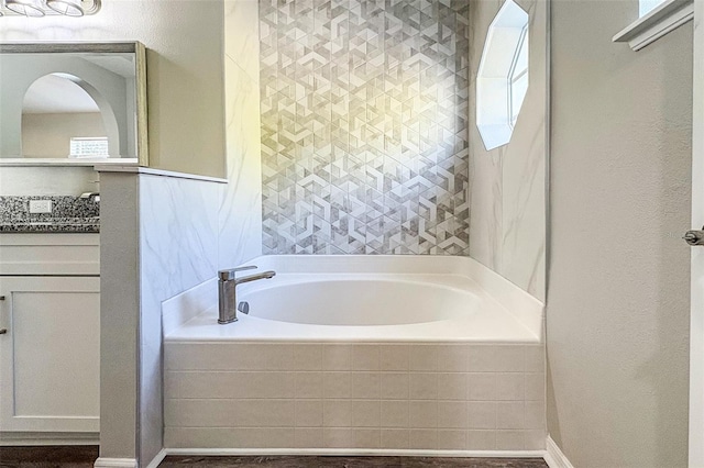 bathroom featuring tiled bath