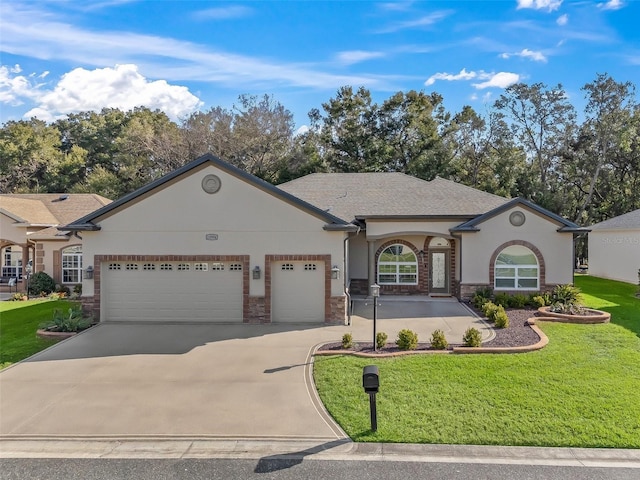 ranch-style house featuring a garage and a front lawn