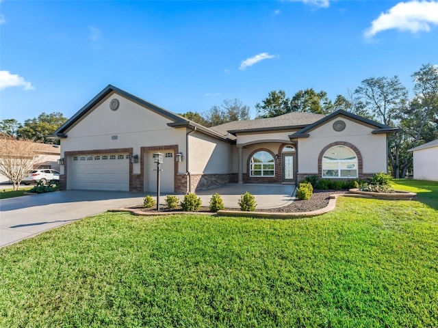 ranch-style house featuring a garage and a front lawn