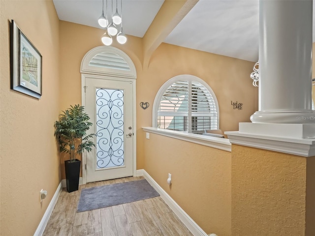 foyer with an inviting chandelier