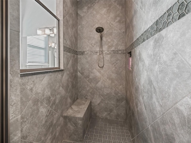 bathroom with tiled shower