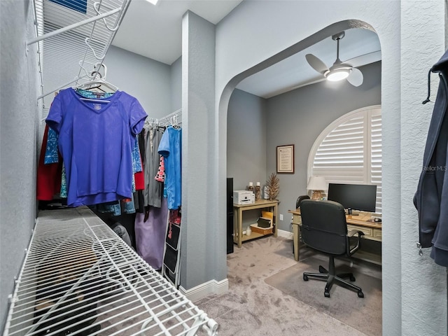 carpeted bedroom with ceiling fan