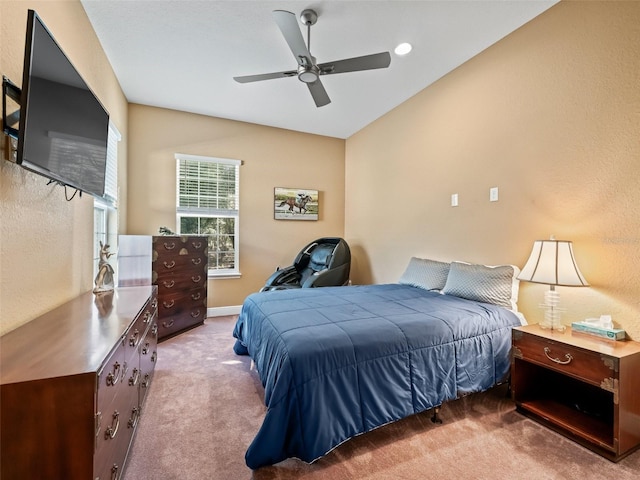 bedroom with ceiling fan and carpet floors