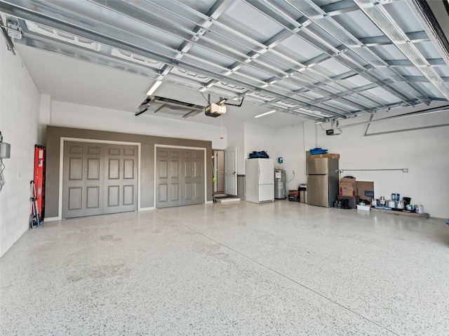 garage with white fridge, stainless steel fridge, electric water heater, and a garage door opener