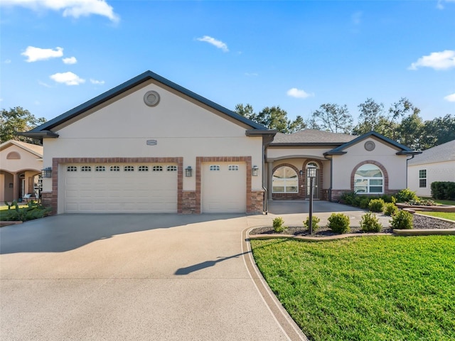 view of front of house featuring a front lawn and a garage