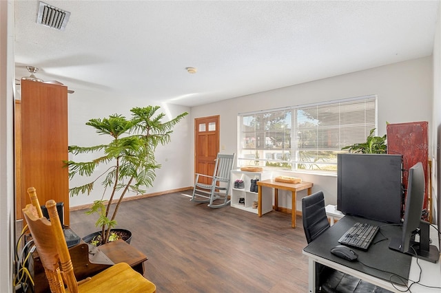 office space with hardwood / wood-style floors and a textured ceiling