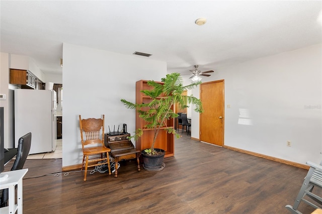 sitting room featuring ceiling fan and wood-type flooring