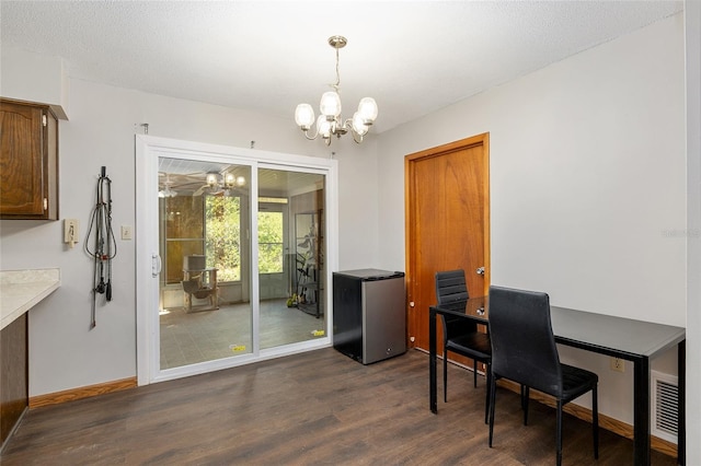 office area featuring a chandelier and dark hardwood / wood-style flooring