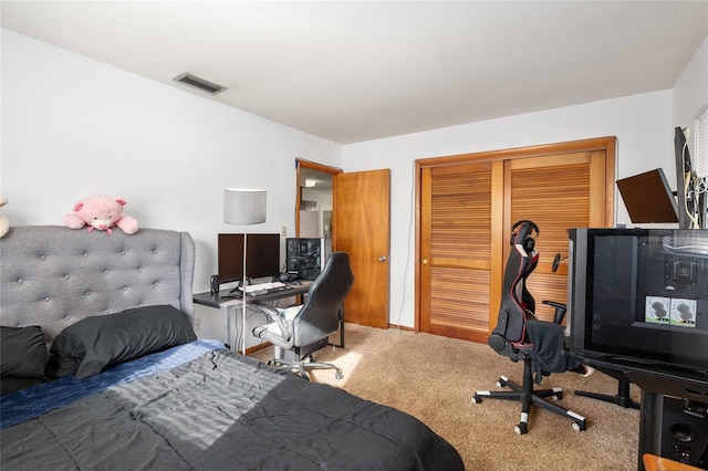 bedroom featuring carpet and a closet