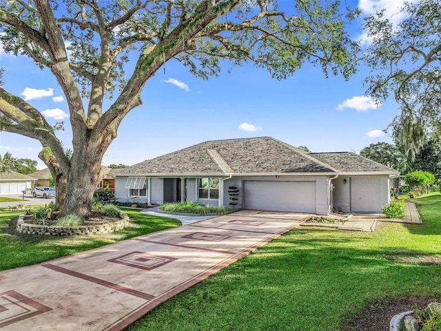 ranch-style house featuring a front yard and a garage