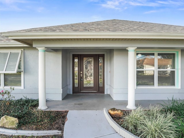 doorway to property with covered porch