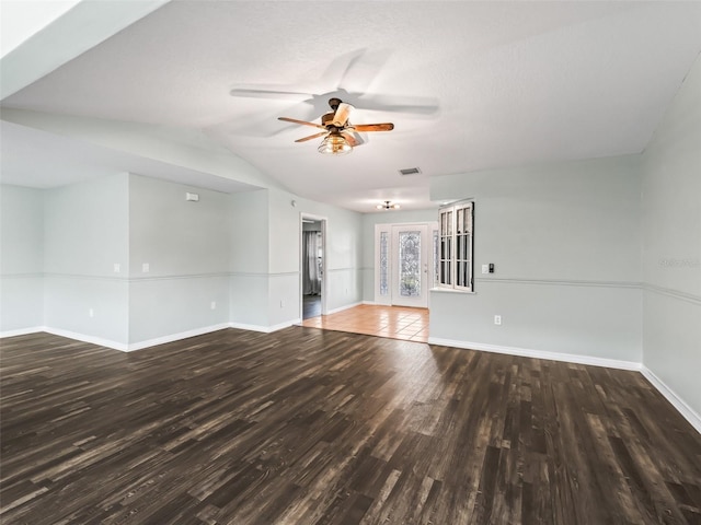 unfurnished room featuring vaulted ceiling, ceiling fan, and dark wood-type flooring