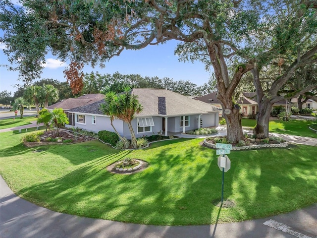 ranch-style home with a front yard