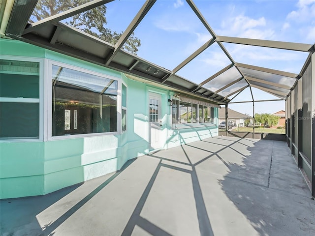 view of patio / terrace featuring a lanai