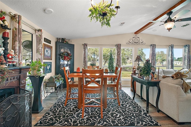 dining area with vaulted ceiling with beams, hardwood / wood-style flooring, plenty of natural light, and ceiling fan