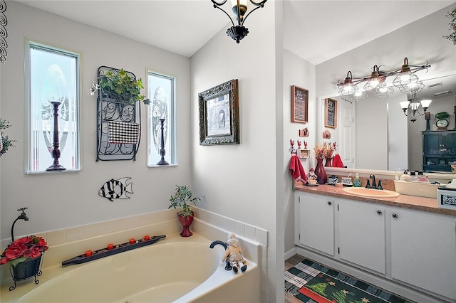 bathroom featuring vanity and a bathtub