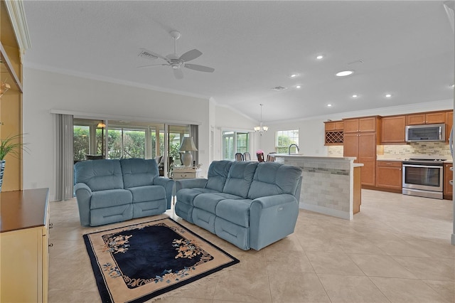 living room with sink, ceiling fan with notable chandelier, crown molding, and light tile patterned flooring