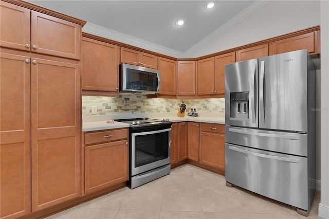 kitchen featuring backsplash, stainless steel appliances, vaulted ceiling, and ornamental molding