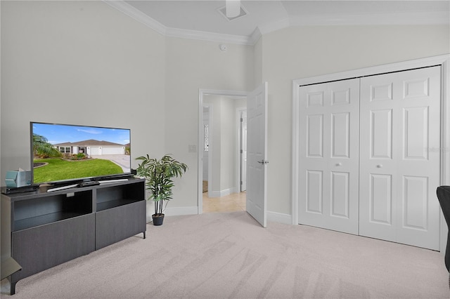 interior space featuring lofted ceiling, light colored carpet, and ornamental molding