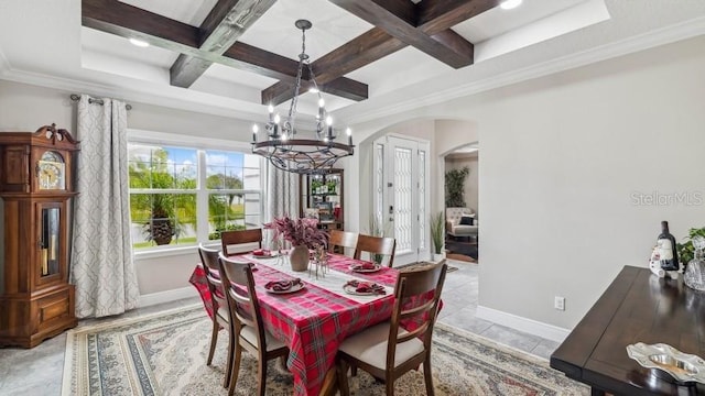 dining space featuring a chandelier, beam ceiling, crown molding, and coffered ceiling