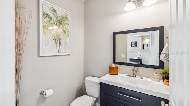 bathroom with vanity and toilet