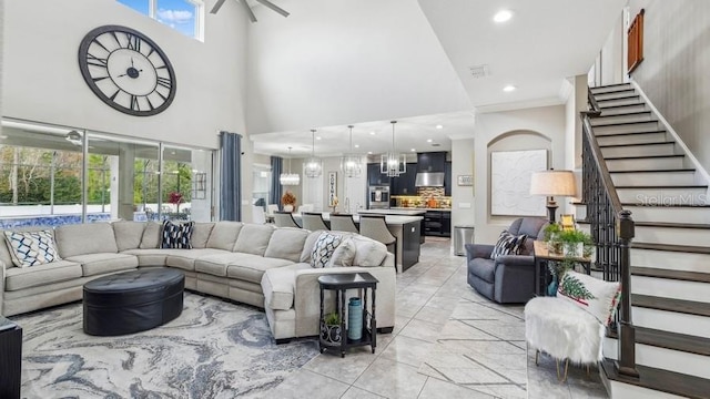 living room with a chandelier and a high ceiling