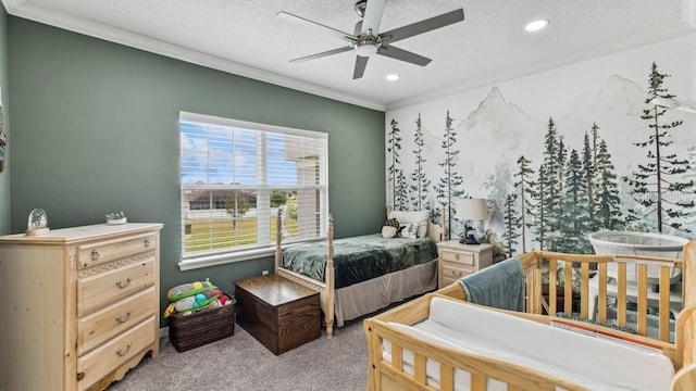 bedroom featuring light carpet, a textured ceiling, ceiling fan, and ornamental molding