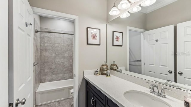 full bathroom with tile patterned flooring, vanity, toilet, and tiled shower / bath