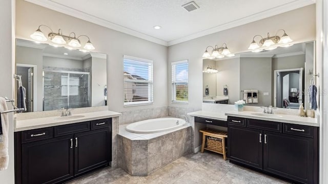 bathroom with tile patterned flooring, vanity, crown molding, and shower with separate bathtub