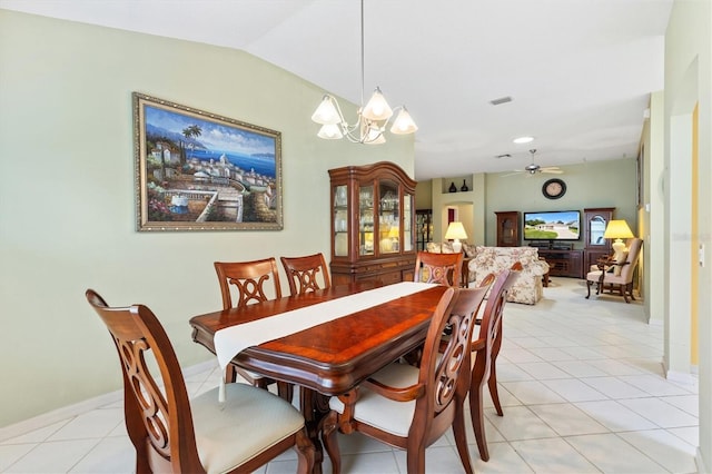 dining room with lofted ceiling, light tile patterned floors, and ceiling fan with notable chandelier