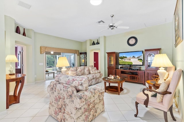 tiled living room with ceiling fan