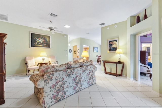 living room with ceiling fan and light tile patterned flooring