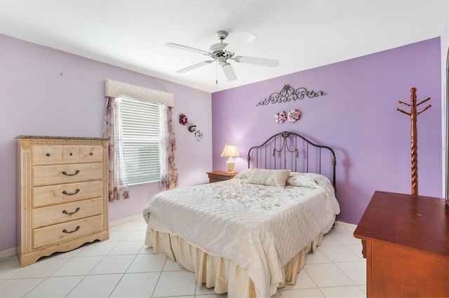 bedroom with ceiling fan and light tile patterned flooring