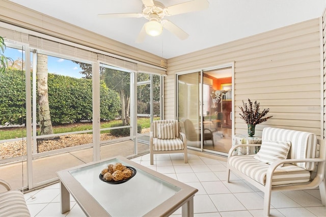 sunroom / solarium featuring ceiling fan