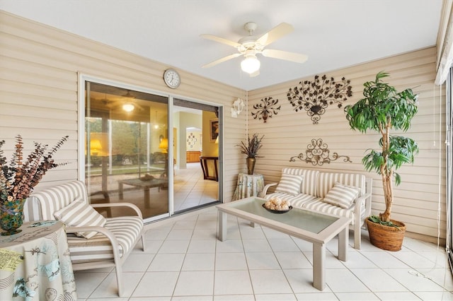 interior space with ceiling fan