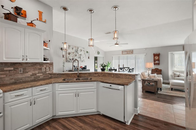 kitchen with white dishwasher, ceiling fan, sink, white cabinets, and dark hardwood / wood-style floors