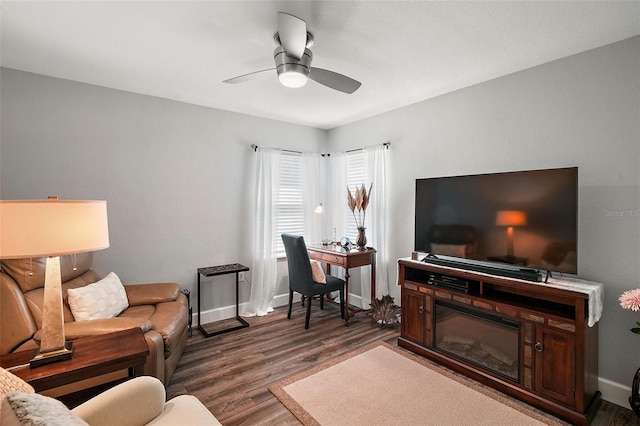 living room with ceiling fan and dark hardwood / wood-style flooring