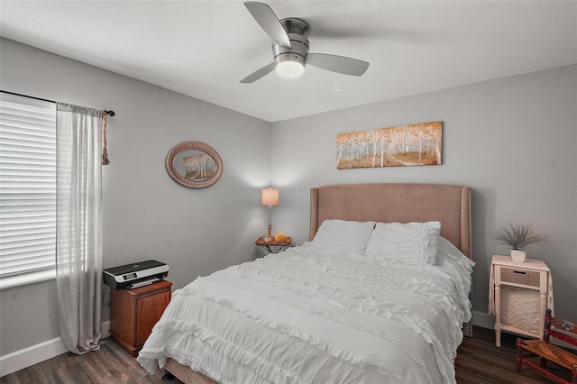 bedroom featuring ceiling fan and dark hardwood / wood-style flooring