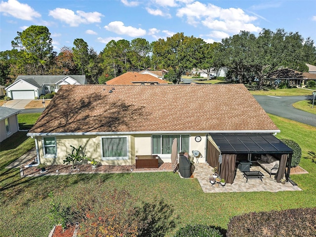 back of house featuring a yard and a patio area