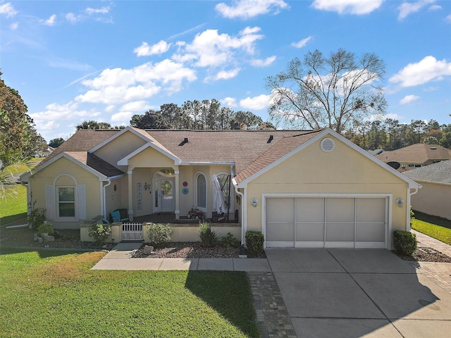 single story home featuring a front lawn, a porch, and a garage