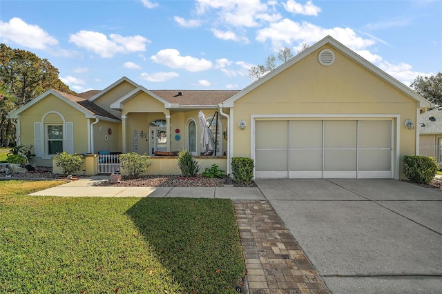 single story home featuring a front yard and a garage