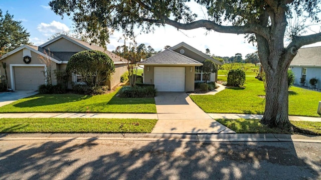 view of front of property with a garage and a front lawn